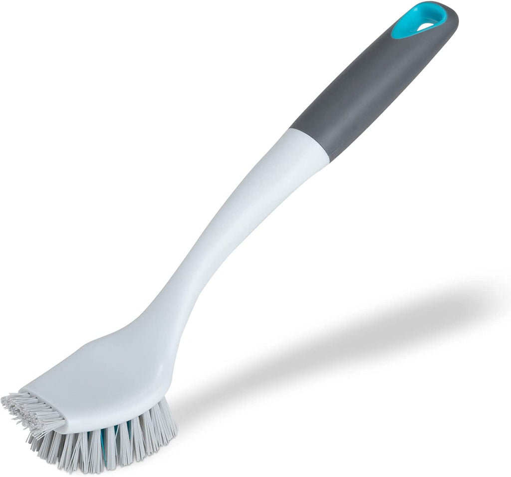 Sink cleaning brush outlet
